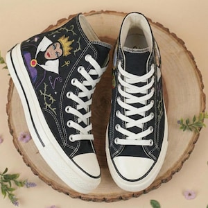 May include: A set of three ceramic mugs with a speckled, matte finish. The mugs are in shades of cream, light gray, and dark gray. Each mug has a simple, modern design, perfect for coffee or tea.