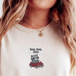 Embroidered Funny Raccoon Driving Shirt, Beep Beep Bitch Tee, Embroidered Animal Car Top, Comfort Colors® Graphic Gift For Chaotic Friends