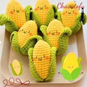 May include: A collection of handmade crochet corn on the cob toys. Each piece features yellow kernels, green husks, and a smiling face with rosy cheeks. The image includes the text "Chas tofu".