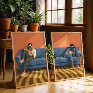 May include: Two framed rectangular art prints featuring illustrations of individuals sitting on a blue sofa. One print shows a person reading a book, while the other shows a person reading a blue book. Both prints depict a wavy orange and green floor pattern.