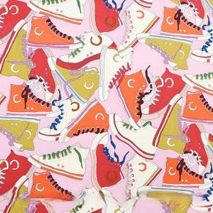 May include: A repeating pattern of high-top trainers in shades of red, orange, white, and green, set against a pink backdrop. The trainers feature white laces and a classic design with rubber soles and canvas uppers.