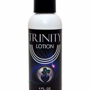 May include: A white bottle of Trinity Lotion with a black cap. The label features the text "TRINITY LOTION" in white, with a graphic of a heart and plant. The bottle contains 4 fl. oz.