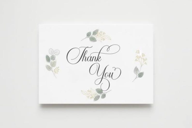 May include: White card with the words "Thank You" in elegant script. The card is decorated with watercolor-style botanical illustrations in shades of green and cream, creating a soft, natural aesthetic.