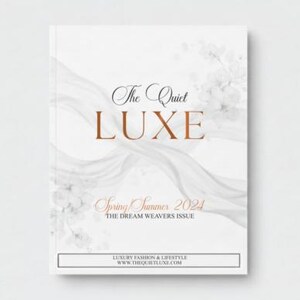 May include: A white magazine cover with the title "The Quiet LUXE" in elegant typography. The cover features a flowing, abstract design and the text "Spring Summer 2024". The magazine is focused on luxury fashion and lifestyle.