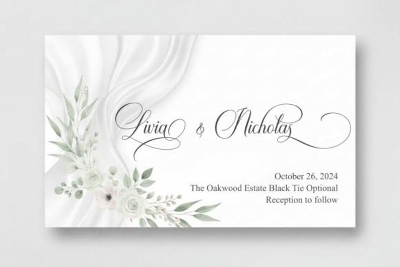 May include: A white wedding invitation with elegant script lettering reading "Livia & Nicholas." The card features floral accents in soft green and white, with the date "October 26, 2024" and event details.