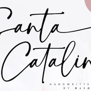 May include: A digital graphic featuring the words "Santa Catalina" in elegant, black, handwritten script. The words are set against a soft, white background with a subtle, blurred design. A pink circle with "NEW FONT" is in the upper right corner.