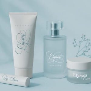 May include: Cosmetic product set featuring a white tube of moisturizer, a perfume bottle, a jar of cream, and a lip serum tube. All items have the word "Elyss&eacute;a" in a script font. The products are arranged on a light blue surface.