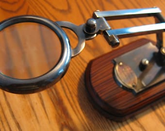 Reproduction of an 1814 LONDON Magnifying Glass on stand in antiqued Brass and Wood. Watts and Sons, LTD.