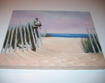 May include: A painting of a beach scene with a wooden fence and a buoy hanging from a post. The fence is partially submerged in the sand, and the buoy is painted red, white, and green. The beach is empty, and the ocean is a light blue color.