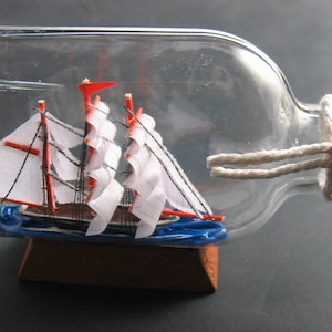 Ship in a Bottle- Barquentine under Sail- White Hull 5&quot; long Excellent with Stand