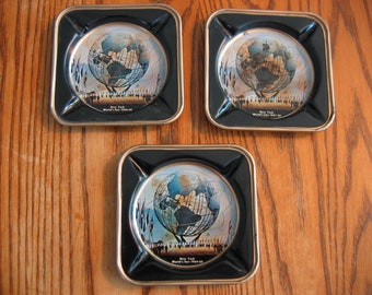 Kavel van 3 US Steel 1964-65 New York WORLD'S FAIR metalen asbakken