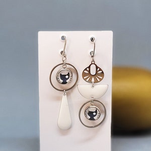 White and black cat mismatched dangling earrings in stainless steel