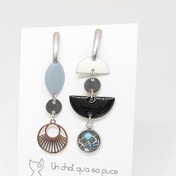 Long mismatched creator earrings with graphic black and white flower patterns in glass and black and grey enamelled sequins