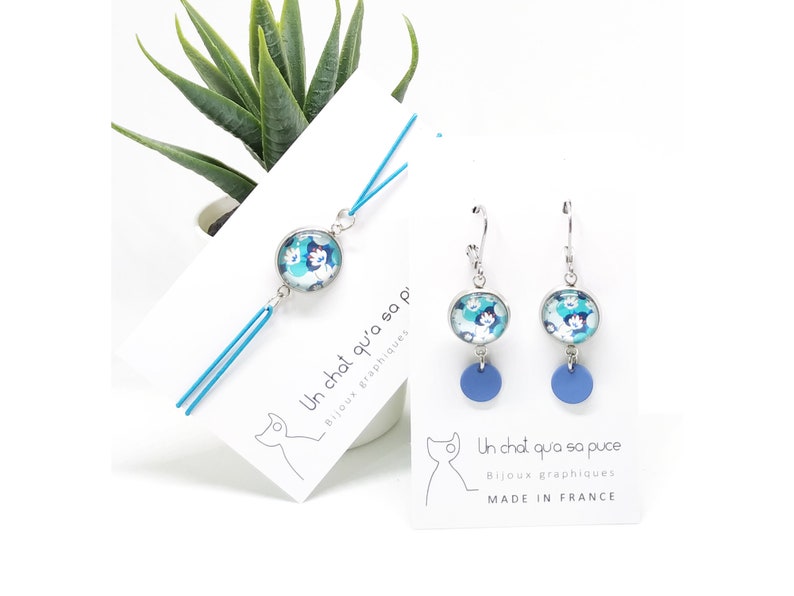 Parure boucles d/'oreilles et bracelet ajustable motif fleurs bleues