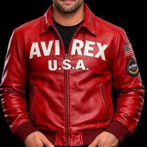 May include: A bright red leather jacket featuring a fold-down collar, a full-length front zipper, and dark red ribbed cuffs and hem. The chest displays white text reading AVI REX U.S.A., while the left sleeve features a small American flag patch.