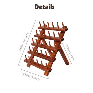May include: A wooden thread spool holder with four tiers, each holding multiple spools. The holder is 9.33 inches wide, 10.24 inches tall, and 6.69 inches deep. The word "Details" is at the top.
