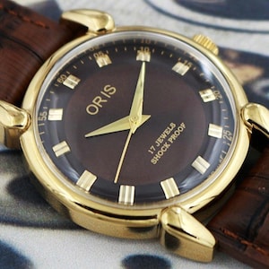 Montre vintage Oris pour homme, fabrication suisse, remontage manuel, cadran marron, cosses en forme de larme, 17 rubis - 210-11