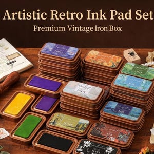 May include: A retro ink pad set in a premium vintage iron box. The set features rectangular metal containers with various coloured ink pads. The colours include purple, orange, green, blue, silver, yellow, red, and black. The containers are labelled with text such as "Fantasy Purple", "Orange", "Green", "Moonlight Silver", "Yellow", "Count Red", and "Sweetneutral Black".