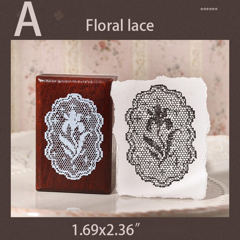 May include: A rectangular wooden stamp with a floral lace pattern in white, accompanied by a white paper swatch showing the same floral lace design stamped in black ink. The stamp measures 1.69 by 2.36 inches as indicated by the text.
