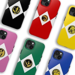 May include: A collection of colorful phone cases in black, red, pink, green, yellow, and blue. Each case features a white diamond with a gold emblem and a diagonal white stripe. The cases are designed for a smartphone.