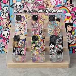 May include: A display of six phone cases with colorful, cartoon-style designs. The cases feature various characters and patterns, including a woman, a nurse, and a variety of other figures. The background has the text "OVER 10+ DIFFERENT DESIGNS".