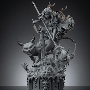 May include: A gray resin statue featuring a figure in a ruffled dress holding a long spear and a dagger, standing atop a creature with a wide grin. The base includes a sculpted doll head and a central emblem of a jester-like figure with pointed ears.