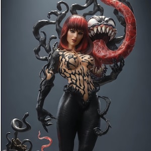 May include: A detailed collectible figurine featuring a figure with red hair and a black symbiote-like suit with intricate patterns. Behind the figure, a monstrous creature with sharp white teeth and a long, textured red tongue emerges from black tendrils.