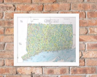 May include: A framed map of Connecticut, with the state's name at the top. The map is filled with green, yellow, and blue colors, and is set against a white background. The frame is white, and the background is a brick wall.