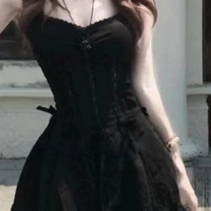 Lace Trim Mini Dress | Slim Fit Sleeveless Style | Y2K Gothic Grunge Streetwear

Lace trim slim mini dress with bow detail designed for women gothic styling and chic everyday outfits.