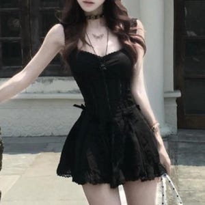 Lace Trim Mini Dress | Slim Fit Sleeveless Style | Y2K Gothic Grunge Streetwear

Lace trim slim mini dress with bow detail designed for women gothic styling and chic everyday outfits.