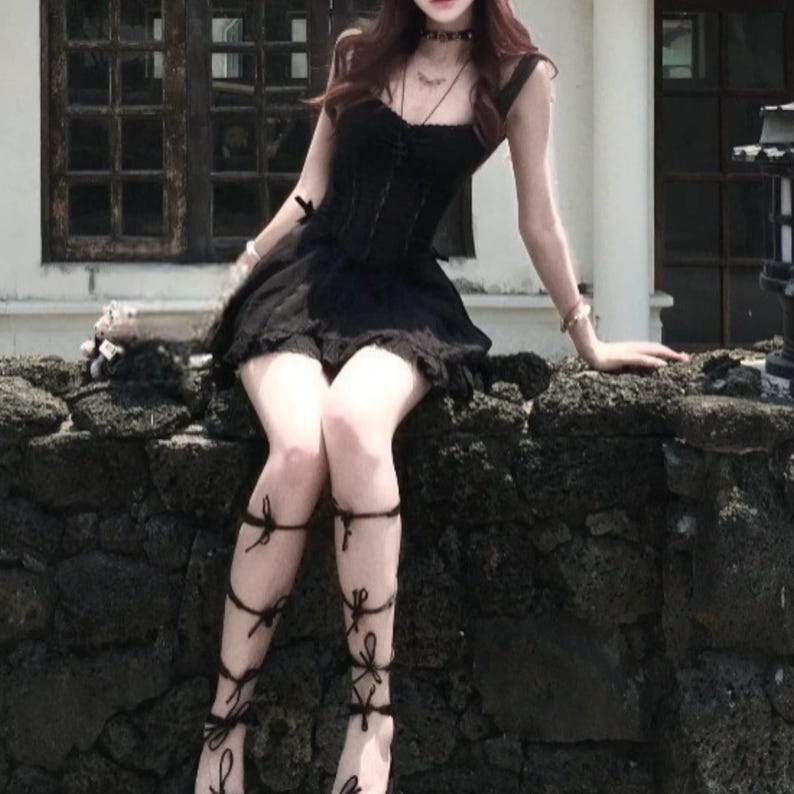 Lace Trim Mini Dress | Slim Fit Sleeveless Style | Y2K Gothic Grunge Streetwear

Lace trim slim mini dress with bow detail designed for women gothic styling and chic everyday outfits.