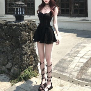 Lace Trim Mini Dress | Slim Fit Sleeveless Style | Y2K Gothic Grunge Streetwear

Lace trim slim mini dress with bow detail designed for women gothic styling and chic everyday outfits.