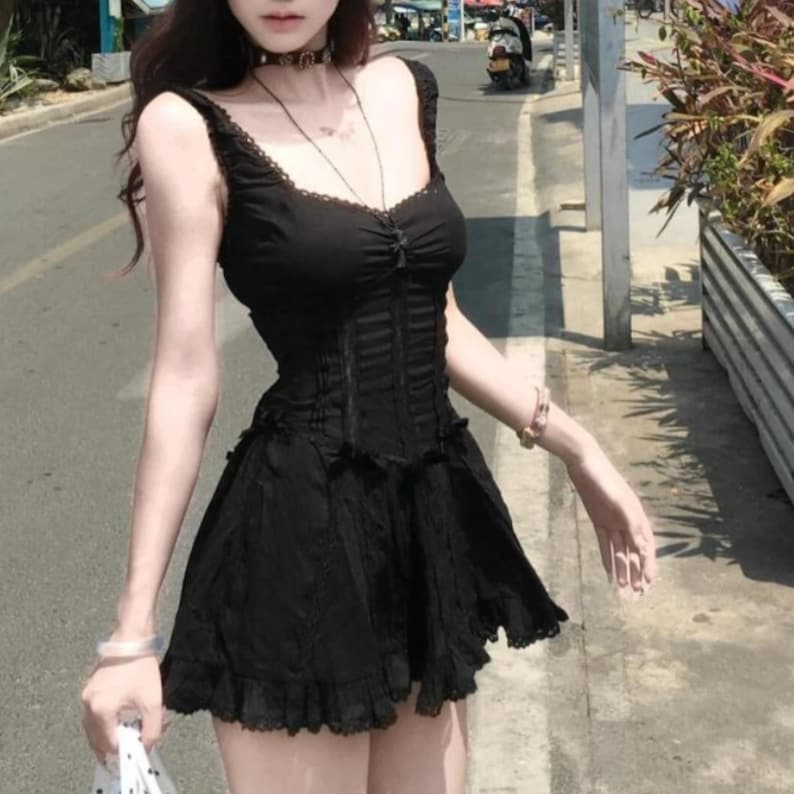 Lace Trim Mini Dress | Slim Fit Sleeveless Style | Y2K Gothic Grunge Streetwear

Lace trim slim mini dress with bow detail designed for women gothic styling and chic everyday outfits.