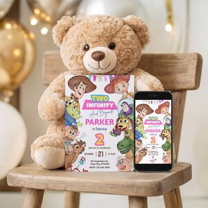 May include: A birthday invitation and a smartphone displaying the same design, featuring characters from a popular animated film. The invitation reads "Two Infinity And Beyond! Parker is turning 2." A plush teddy bear sits behind the invitation.