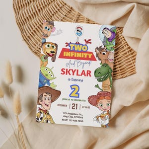 May include: A white invitation card featuring characters from the Toy Story movie. The card reads "Two Infinity And Beyond!" and "Skylar is turning 2." The invitation includes the date, time, and RSVP information.