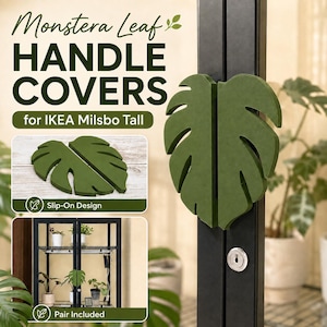 May include: A pair of dark green monstera leaf-shaped handle covers designed for the IKEA Milsbo Tall cabinet. The covers feature a slip-on design and are shown attached to the black vertical door handles of the cabinet, with text included.