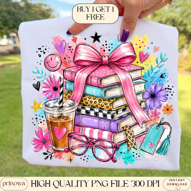 May include: A white t-shirt featuring a colorful graphic of a stack of books tied with a large pink bow, a plastic cup with a straw, and pink glasses. The design includes flowers, hearts, stars, and the text BUY 1 GET 1 FREE at the top.