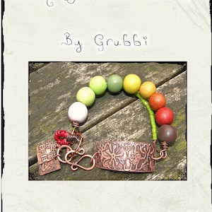 May include: A copper bracelet with a charm and beads in shades of green, yellow, red, and brown. The bracelet is on a wooden surface. The text "Etching Base Metals by Grubbi" is at the top of the image. The text "http://www.etsy.com/shop/grubbi" is at the bottom of the image.
