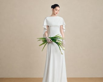Minimalistische zijden trouwjurk, boothals, cape met open achterkant