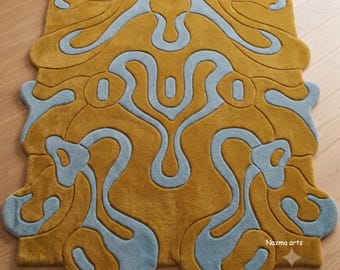 hand tufted wool rug | irregular shaped carpet | mustard yellow and blue | abstract swirl design | modern living room mat | new home gift