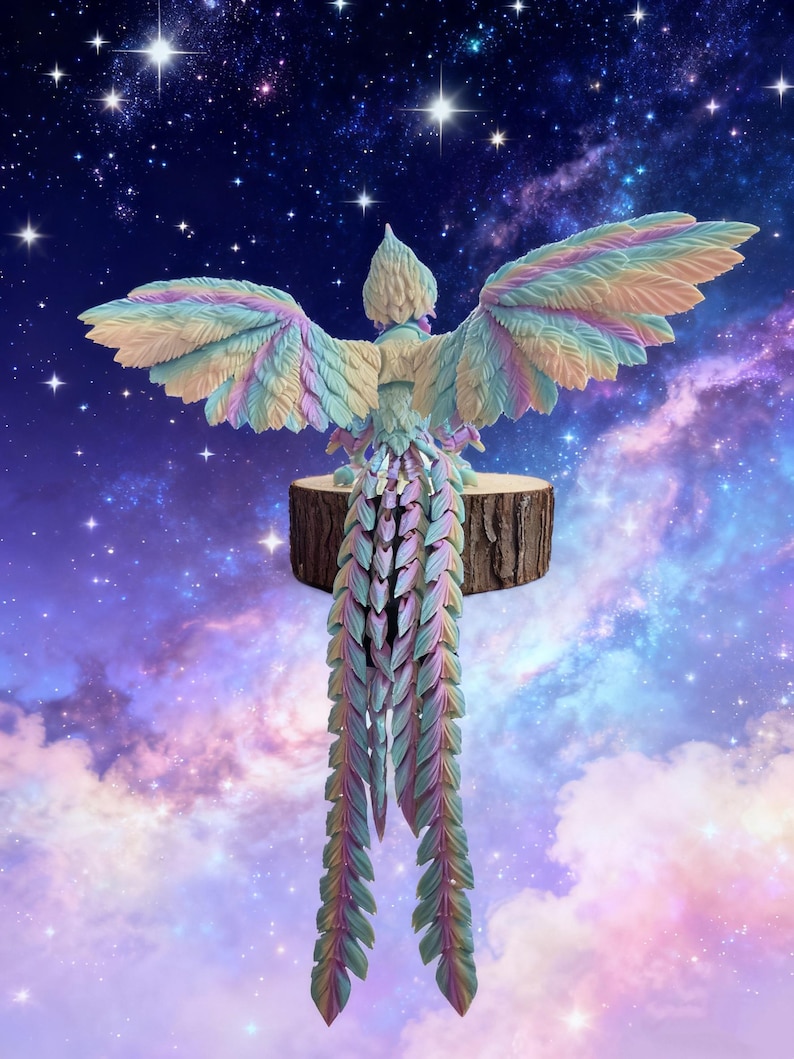 May include: A colorful, carved bird sculpture with outstretched wings, perched on a wooden base. The bird features pastel shades of blue, green, pink, and yellow. The background is a starry night sky with clouds.