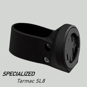 Peut inclure: Support de compteur de vélo noir avec le texte "SPECIALIZED Tarmac SL8". Le support est conçu pour maintenir un compteur de vélo et est fabriqué dans un matériau durable. Le support a un design élégant et moderne.
