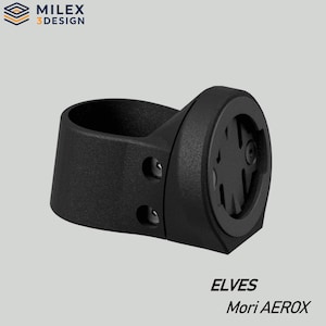 May include: Black bicycle computer mount with the text "ELVES Mori AEROX". The mount has a circular design with a mounting bracket and two screw holes. The logo "MILEX 3DESIGN" is in the upper left corner.