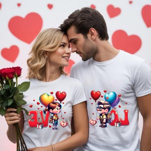 May include: Two people wearing white t-shirts with cartoon graphics. One shirt says "LOVE" with a cartoon girl holding balloons, the other says "YOU" with a cartoon boy holding balloons. Red roses are in the foreground.