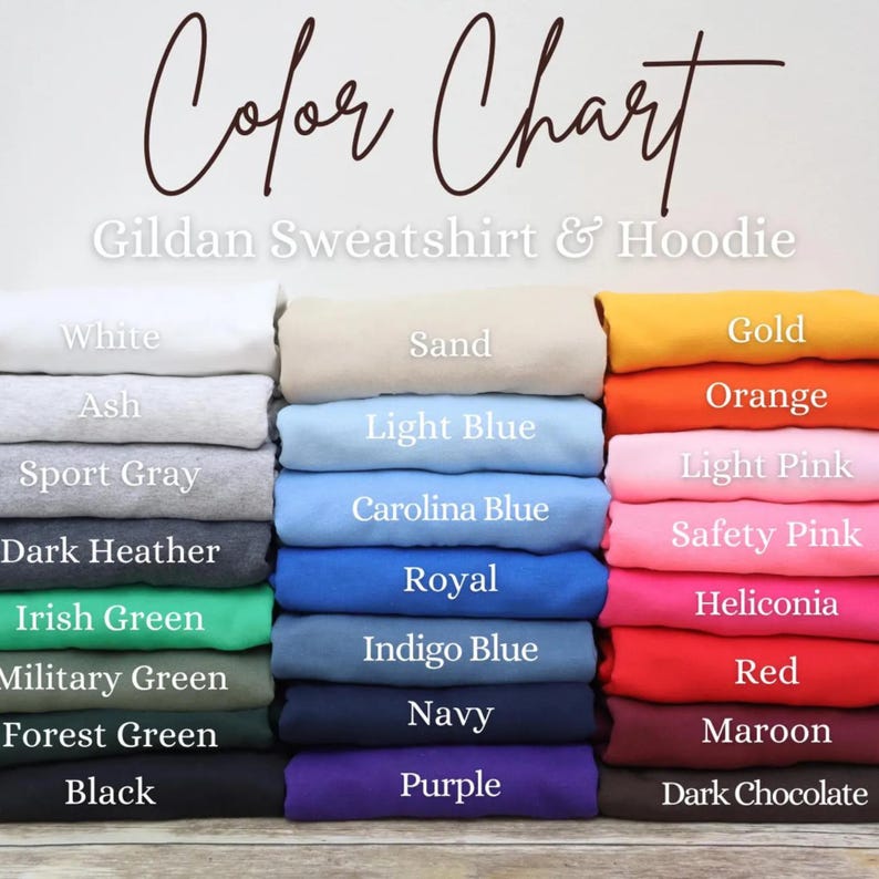 May include: Color chart for Gildan sweatshirts and hoodies, showcasing a variety of colors. Colors include white, ash, sport gray, dark heather, Irish green, military green, forest green, black, sand, light blue, Carolina blue, royal, indigo blue, navy, purple, gold, orange, light pink, safety pink, heliconia, red, maroon, and dark chocolate.
