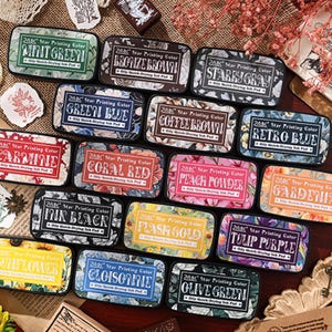 May include: A selection of rectangular ink pads in colours such as mint green, bronze brown, and starry grey. Each pad displays the text "2ABC Star Printing Color" and the colour name. The pads feature floral and patterned designs.