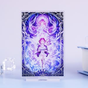 May include: A clear acrylic stand featuring a vibrant anime-style illustration. The artwork depicts two figures in shades of purple and white, surrounded by celestial elements. The stand is supported by a clear base, perfect for displaying art.