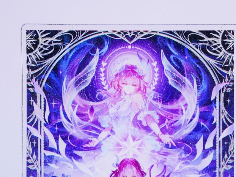 May include: A vibrant illustration featuring a female anime character with pink hair and a white dress. The artwork is set against a backdrop of blues and purples, with intricate details and a celestial theme. The image has a fantasy art style.