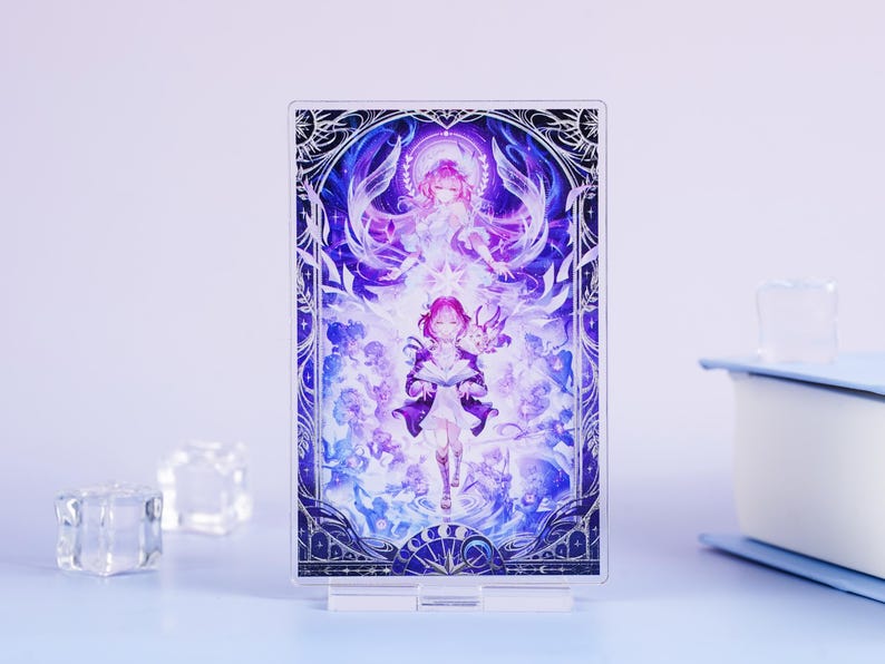 May include: A clear acrylic stand featuring a vibrant anime-style illustration. The artwork depicts two figures in shades of purple and white, surrounded by celestial elements. The stand is supported by a clear base, perfect for displaying art.