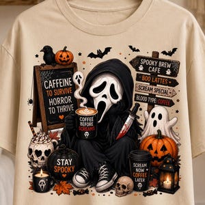 May include: A beige t-shirt featuring a graphic of a hooded figure with a white mask holding a coffee mug and a knife. The design includes pumpkins, a ghost, a skull, and signs reading "Caffeine to survive, horror to thrive" and "Spooky Brew Cafe."
